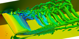 Cavitating foil with vortex field visualised with isosurfaces of the Q criterion of 10000.  Wall coloured by pressure and vortices by velocity magnitude.