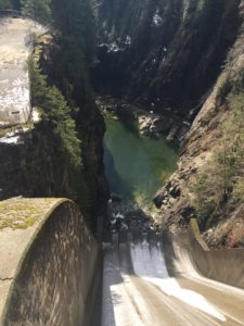 Concrete lined spillway and energy abatement structures before the Capilano River