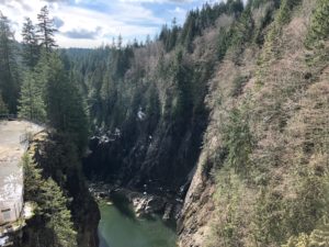 View downstream along the Capilano River from the top of Cleveland Dam.